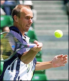 Jens Knippschild of Germany concentrates on his return against United States Michael Chang during the second round of play in the Japan Open Tennis '99 at Tokyo's Ariake Colosseum on Wednesday