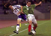 apan's Tomoyuki Sakai (left) and Mexico's Gerardo Torrado fight for control of the ball during a quarter-final Under-20 World Cup soccer match in Ibada