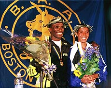 Boston Marathon winners Joseph Chebet of Kenya and Fatuma Roba of Ethiopia pose at a post-race news conference in Boston on Monday