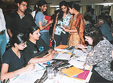 Students check out prospects for studying in Australia at an exhibition in Chandigarh on Tuesday