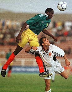 Mali's Tenema N Diaye heads the ball to teammates 