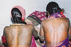 Extensive tattooing on the backs of Baiga women