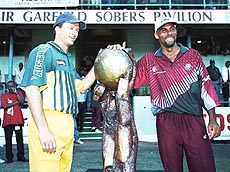 Australia Captain Steve Waugh and West Indies stand-in Captain Jimmy Adams sharing the Cable & Wireless trophy 