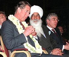 Britain's Prince of Wales talks with Bhai Mohinder Singh