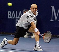 Andre Agassi of Las Vegas returns a shot to Andrew Ilie of Australia during their semifinal match at the Mercedes-Benz Cup in Los Angeles on Saturday. Agassi won the match 6-4, 6-2