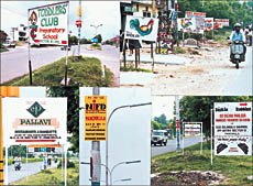 Signboards and advertisement boards continue to exist along the roads in Panchkula