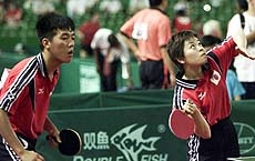 Japan's mixed doubles team of Ryo Yuzawa, left, and Keiko Okazaki in third round action during the Table Tennis World Championships in Eindhoven, The Netherlands