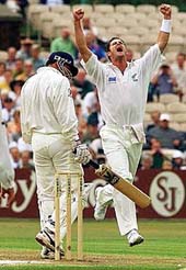 New Zealand bowler Chris Cairns (right) celebrates after having England skipper Mark Butcher caught in the slips by Stephen Fleming 