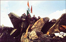 After the victory: The Indian Tricolour flutters atop India Gate (Tiger Hill)
