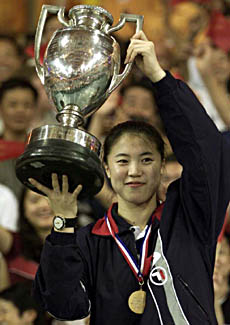 China's Wang Nan holds the trophy after she won the women's singles title at the World Table Tennis Championships in Eindhoven on Saturday