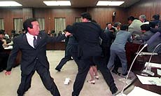 Japanese ruling and opposition lawmakers go into a brawl 