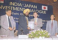 Mr Sukhbir Singh Badal, Union Minister of State for Industry, releases a souvenir on Indo-Japanese investment in New Delhi on Tuesday.