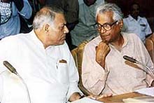Defence Minister George Fernandes in conversation with Finance Minister Yashwant Sinha at the first meeting of the committee to evolve a national policy for the welfare of jawans and ex-servicemen in New Delhi on Tuesday