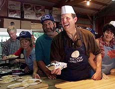 Vice President Al Gore laughs as he prepares to serve patrons at the Iowa State Fair Thursday in Des Moines, Iowa. Gore is on the second day of a two-day campaign swing through Iowa