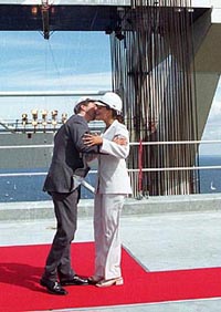 Danish Crown Prince Frederik and Swedish Crown Princess Victoria embrace at the middle of the Oresund Bridge, connecting Denmark to Sweden, Saturday