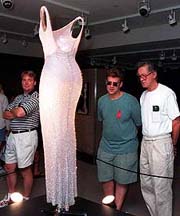 The dress worn by Marilyn Monroe when she sang "Happy Birthday" to President John F. Kennedy is examined by visitors to Christie's auction house in New York