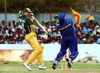 Australian batsman Ricky Ponting (left) looks at the ball as Sri Lankan wicket keeper Romesh Kaluwitharena tries to catch it during the limited over cricket match between Australia and Sri Lanka
