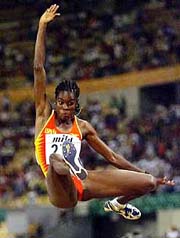 Spain's Niurka Montalvo makes her winning jump of 7.06 meters to win the Women's Long Jump event at the seventh World Track and Field Championships in Seville, Spain, on Monday