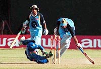 Indian batsman Ajay Jadeja (left) watches as batsman Khurasiya survives a possible runout chance during Aiwa Cup limited overs cricket match between India and Sri Lanka