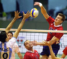 Tom Hoff of the United States (right) spikes the ball against Alejandro Spajic of Argentina (left) during the men's Volleyball World Cup tournament in Tokyo on Tuesday