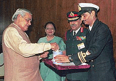Prime Minister Atal Behari Vajpayee making a token donation on the occasion of the armed forces Flag Day in New Delhi on Tuesday