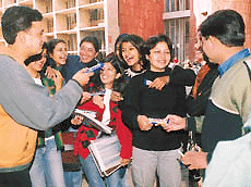 Students of Panjab Universitys Department of English expressing feelings through yummy bars on Chocolate Day on Thursday