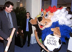 Official mascot of the Euro 2000 greets guests during a media presentation of the European soccer Championships hosted by the Netherlands and Belgium next year, in Brussels on Saturday