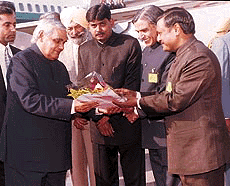 The Prime Minister, Mr Atal Behari Vajpayee, is greeted by Mr Kewal Krishan Addiwal, Mayor; Mr Pawan Kumar Bansal, local MP, and Mr Satya Pal Jain, a former MP from Chandigarh, during his brief halt here on his way to Kulu on Sunday