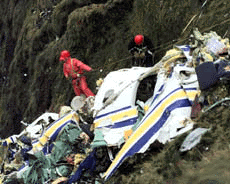 Rescue workers use ropes to get to the wreckage of an ATP turboprop airplane which crashed on the mountains of the Azores island of Sao Jorge, on Sunday