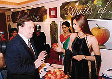 Former Miss World Diana Hayden samples French apples after the inauguration of the exhibition France India Art de Vivre at the Oberoi in Mumbai on Monday