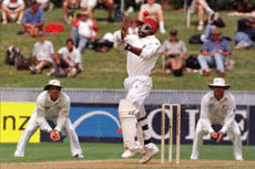 West Indies opening batsman Sherwin Campbell centre, flails at a bouncer from New Zealand's Chris Cairns on the first day of the first test at Westpac Trust Park, Hamilton, on Thursday. Campbell had reached his century just before the tea break