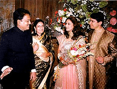 Maharashtra Chief Minister Vilasrao Deshmukh and his wife Vaishali greet film actress Madhuri Dixit and her husband, Dr Sriram Nene, at their wedding reception in Mumbai on Saturday