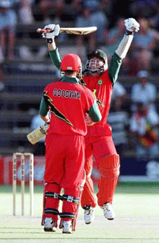 Zimbabwe's captain Andy Flower (right) celebrates with partner Murray Goodwin after they beat Sri Lanka in the final one day international at the Harare Sports Club on Sunday