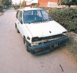 A car on the roadside which was damaged while the robbers were trying to flee from the scene