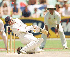 England batsman Mark Butcher avoids a bouncer from South Africa's Mornanthau Hayward, during the first day of the Third Test match between England and South Africa, held at Kingsmead in Durban, South Africa on Sunday