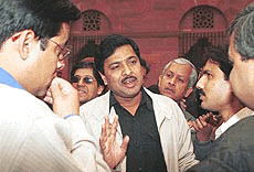 Parliamentary Affairs Minister Pramod Mahajan talks to mediapersons after a Cabinet meeting at Prime Minister’s Office in New Delhi on Wednesday