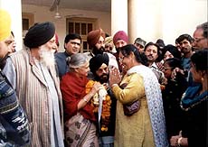 Women thanking Delhi Chief Minister Sheila Dikshit for her decision to exempt women pillion riders on two-wheelers from wearing helmets in New Delhi 