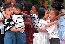 Orphans embrace each other