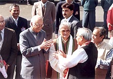 Home Minister L.K. Advani bids adieu to Prime Minister Atal Behari Vajpayee at the Palam airport as the latter leaves for the journey to Pakistan on Saturday. — Photo by Vijender Tyagi