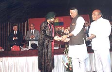 Punjabi Popking Daler Mehndi being honoured by Finance Minister, Mr. Yashwant Sinha, at a function in the Capital on Monday . Photo by T.C.Malhotra