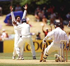 India's Sachin Tendulkar (left) celebrates the wicket of New Zealand's Mathew Bell (right) during the 4th day of the 3rd cricket test played at the Westpak Trust Park in Hamilton on Tuesday — AP/PTI