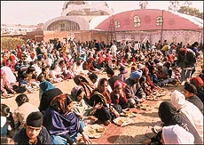 Devotees partaking of langar