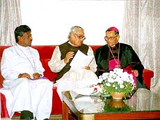 Prime Minister A.B.Vajpayee going through a memorandum regarding the recent attack on Christians, presented to him by the Archbishop of Bangalore Ignatius Pinto (right) and Bishop Vasanta Kumar in Bangalore on Monday