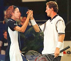 The Swedish team of Jonas Bjorkman and Asa Carlsson celebrate after winning.