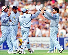 India's Nayan Mongia and Sachin Tendulkar celebrate the lbw dismissal of New Zealand's Matt Horne as skipper Mohd Azharuddin and Ajay Jadeja join them, in the second one day international Napier, New Zealand, on Tuesday. — AP/PTI