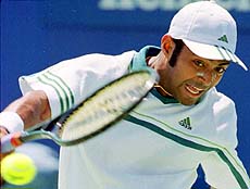 MELBOURNE, AUSTRALIA : Leander Paes returns the ball during his 6-4, 6-4, 6-1, loss to Italian Davide Sanguinetti at the Australian Open Tennis Championships in Melbourne on Monday — AP/PTI
