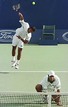 Indian pair Leander Paes and Mahesh Bhupathi play a doubles match.