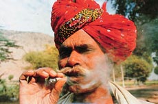 A native caught in the early sun on the outskirts of the town