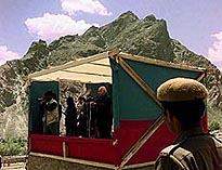 A soldier listens attentively to Home Minister Lal Krishna Advani's speech at Sankoo village near Kargil in Indian-held Kashmir on Wednesday