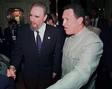 Cuban President Fidel Castro and Venezuela's President Hugo Chavez, are greeted at the entrance of a hotel in Rio de Janeiro, Brazil on Tuesday. Both Presidents are in Rio after participating in the Latin America Caribbean and Euopean Union Summit. 